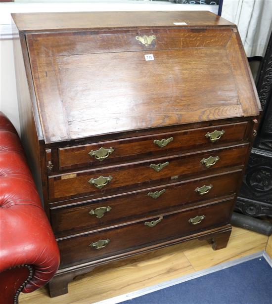 A George III oak bureau, W.87cm